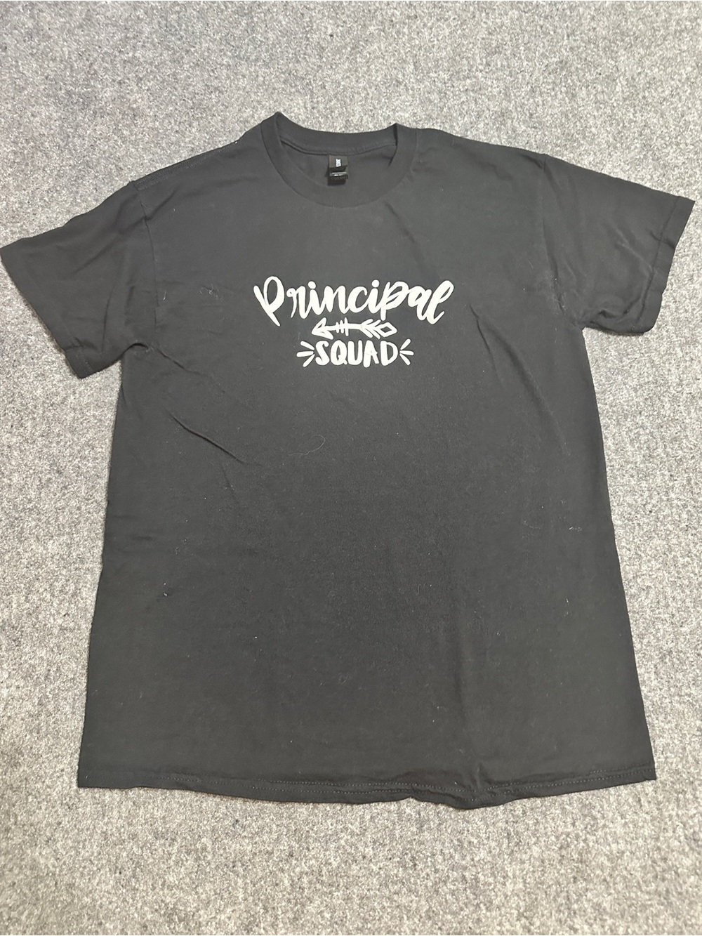 This black cotton crewneck t-shirt features a bold white "Principal Squad"